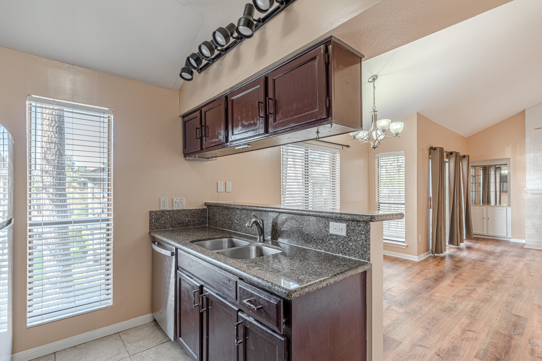 3500 Tangle Brush Drive, Unit 182 Spring, TX 77381 - Photo 16 of 24 a kitchen with stainless steel appliances granite countertop a sink stove and cabinets