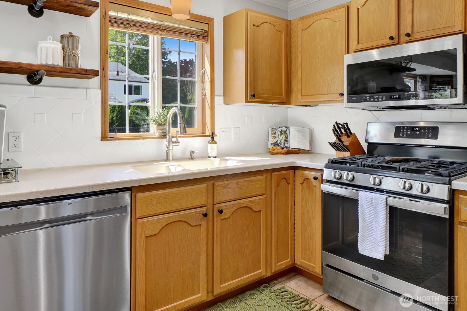6149 Church Road Ferndale, WA 98248 - Photo 13 of 37 a kitchen with a sink stove and microwave