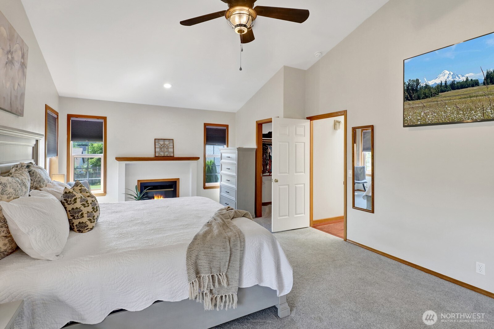 6149 Church Road Ferndale, WA 98248 - Photo 20 of 37 a spacious bedroom with a bed and a fireplace