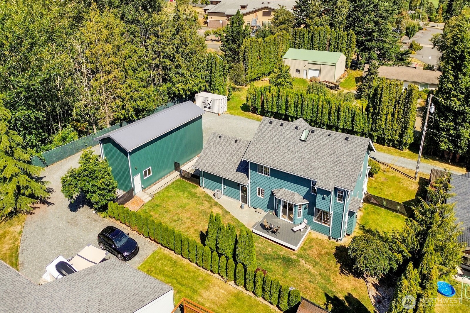 6149 Church Road Ferndale, WA 98248 - Photo 36 of 37 an aerial view of a house with a garden and trees