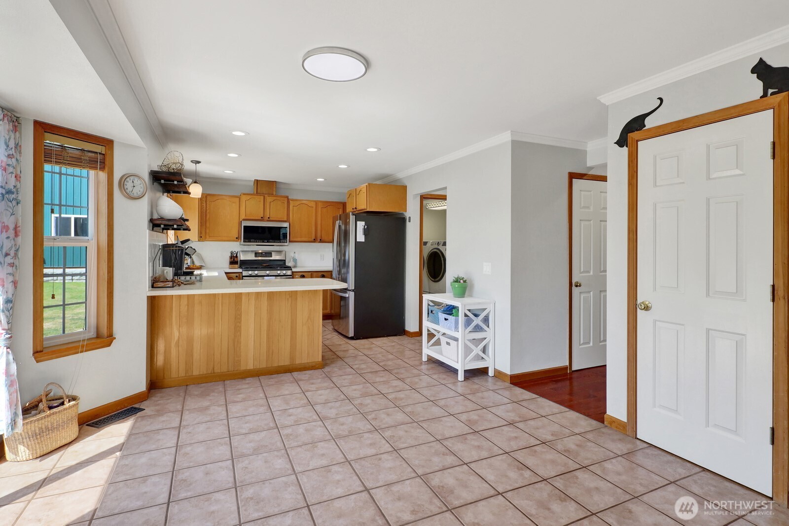 6149 Church Road Ferndale, WA 98248 - Photo 10 of 37 a kitchen with stainless steel appliances a refrigerator and microwave