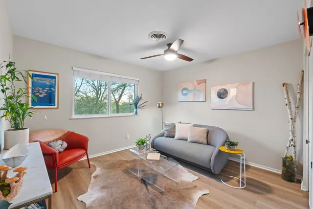 a living room with furniture and a window