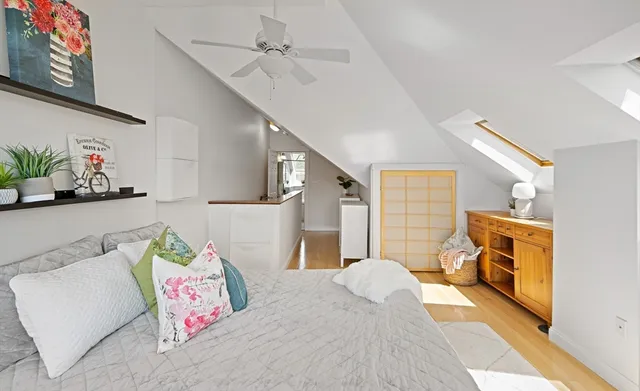 a bedroom with furniture and a fireplace