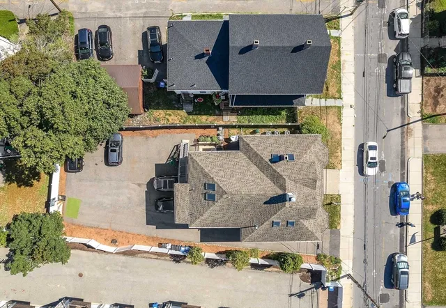 an aerial view of residential houses with outdoor space