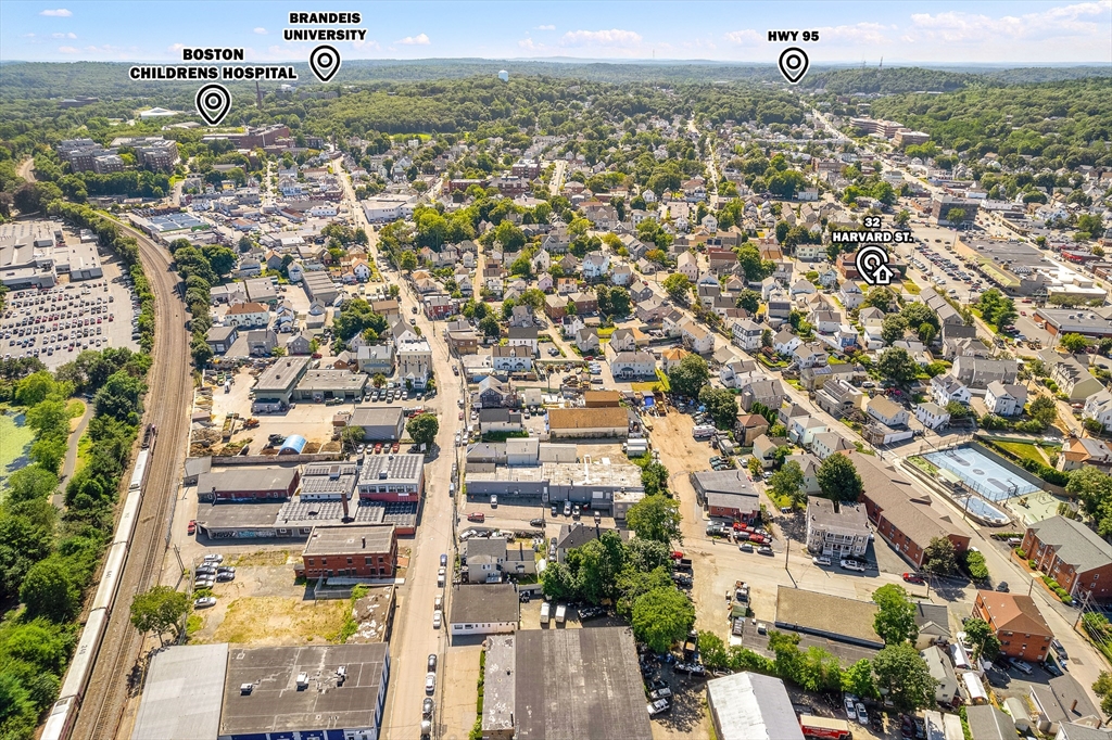 32 Harvard Street, Unit 2 Waltham, MA 02453 - Photo 29 of 32 an aerial view of residential houses with outdoor space