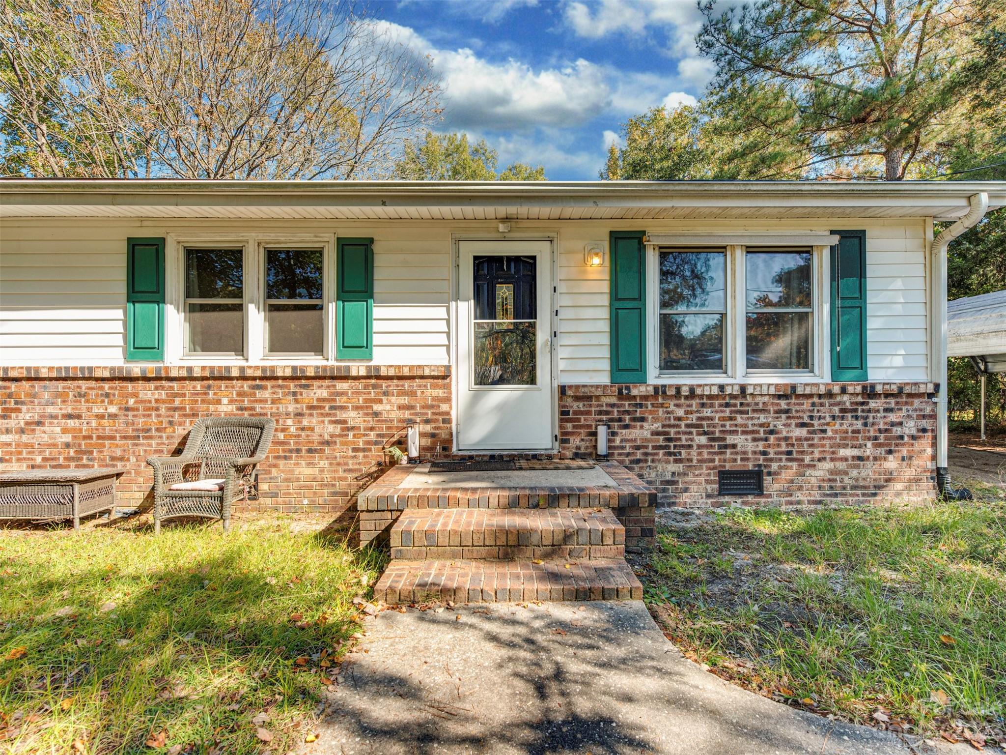 125 Eason Drive Rockingham, NC 28379 - Photo 1 of 26 front view of a house with a yard