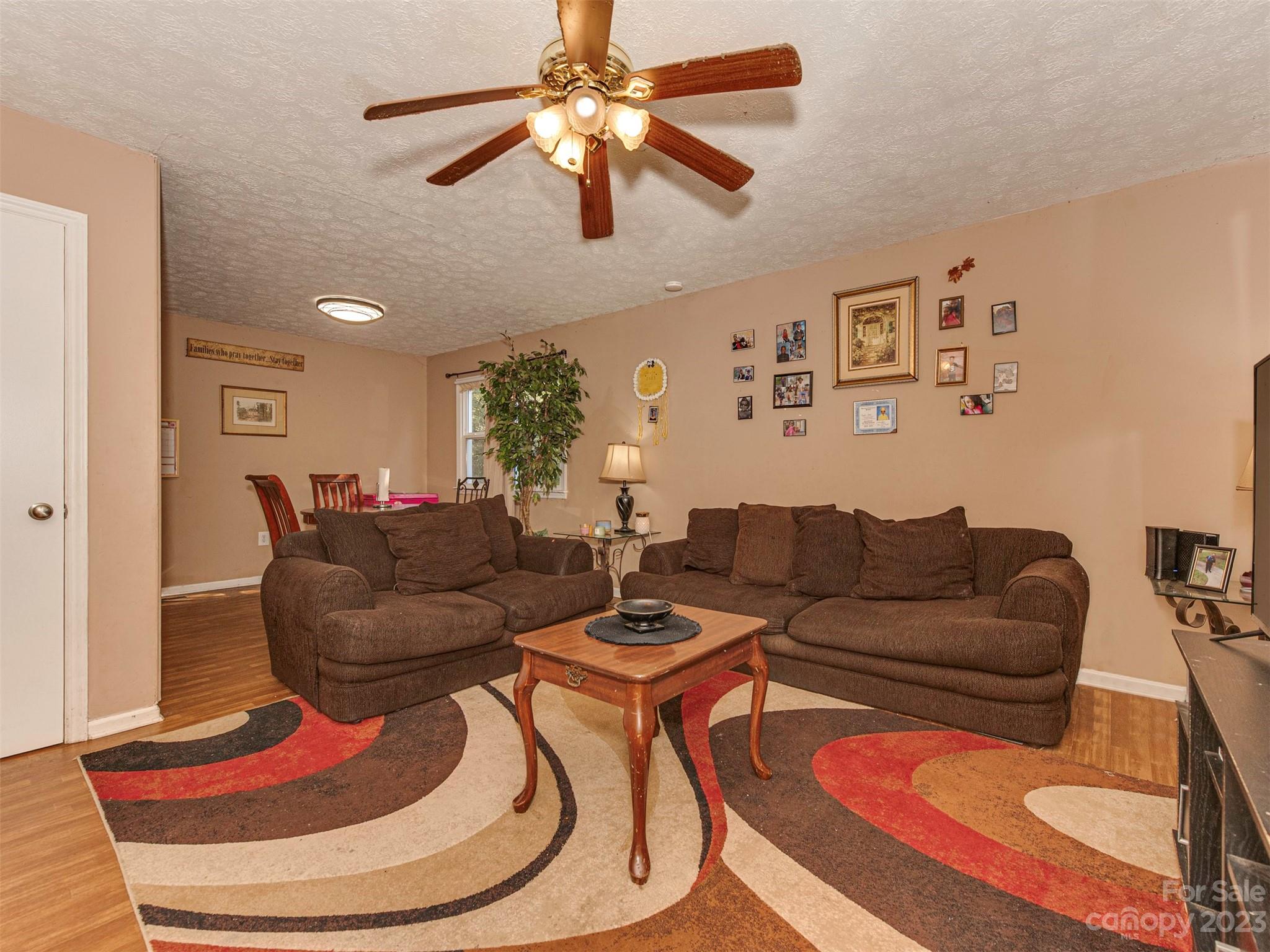 125 Eason Drive Rockingham, NC 28379 - Photo 6 of 26 a living room with furniture and a wooden floor
