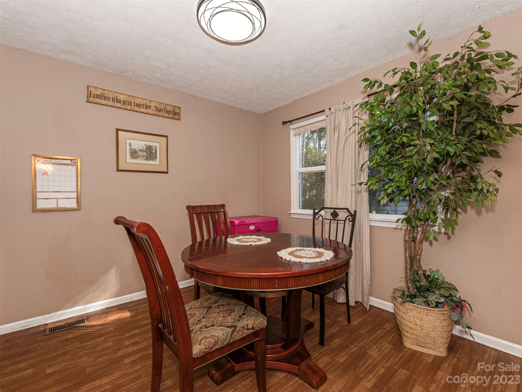 125 Eason Drive Rockingham, NC 28379 - Photo 10 of 26 a dining room with furniture and wooden floor