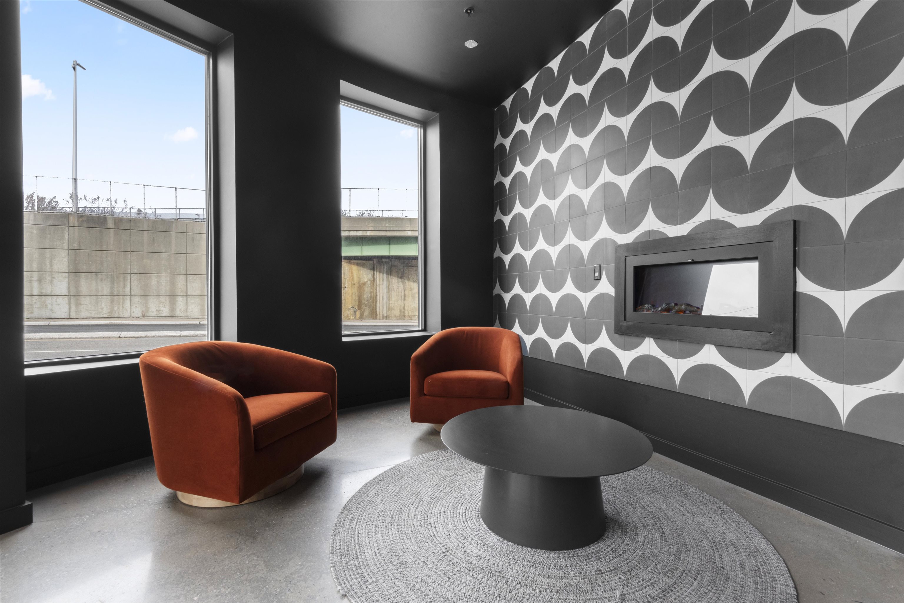 175 West 7th Street, Unit 407 Bayonne, NJ 07002 - Photo 11 of 24 a living room with furniture and a large window