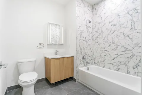 a bathroom with a toilet sink and bathtub