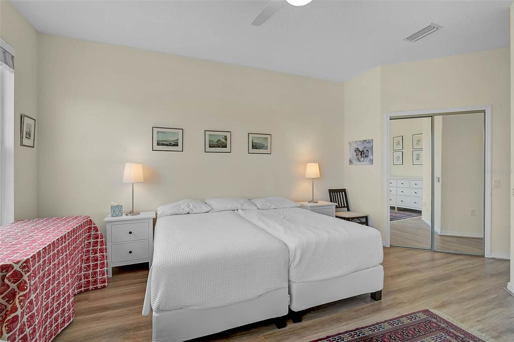 7012 Prosperity Circle, Unit 706 Sarasota, FL 34238 - Photo 16 of 45 a bedroom with a bed and a lamp