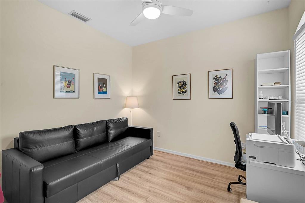 7012 Prosperity Circle, Unit 706 Sarasota, FL 34238 - Photo 20 of 45 a living room with furniture and a wooden floor