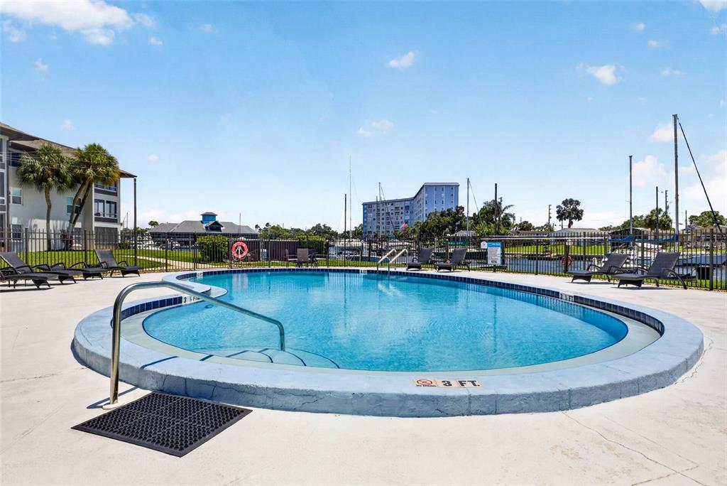 5197 Silent Loop, Unit 124 New Port Richey, FL 34652 - Photo 42 of 55 a swimming pool with outdoor seating and city view