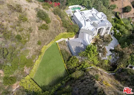 a house with trees in front of it