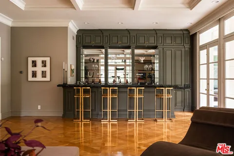 a lobby with furniture and floor to ceiling window