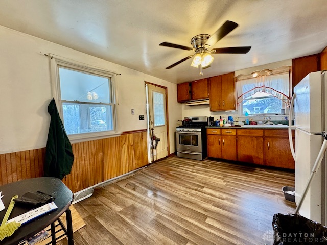 4733 Curtis Drive Springfield, OH 45503 - Photo 13 of 50 This spacious kitchen offers ample room for daily activities and features classic wood paneling.