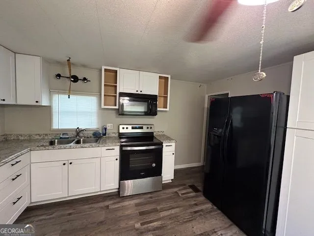 a kitchen with stainless steel appliances a refrigerator stove and sink