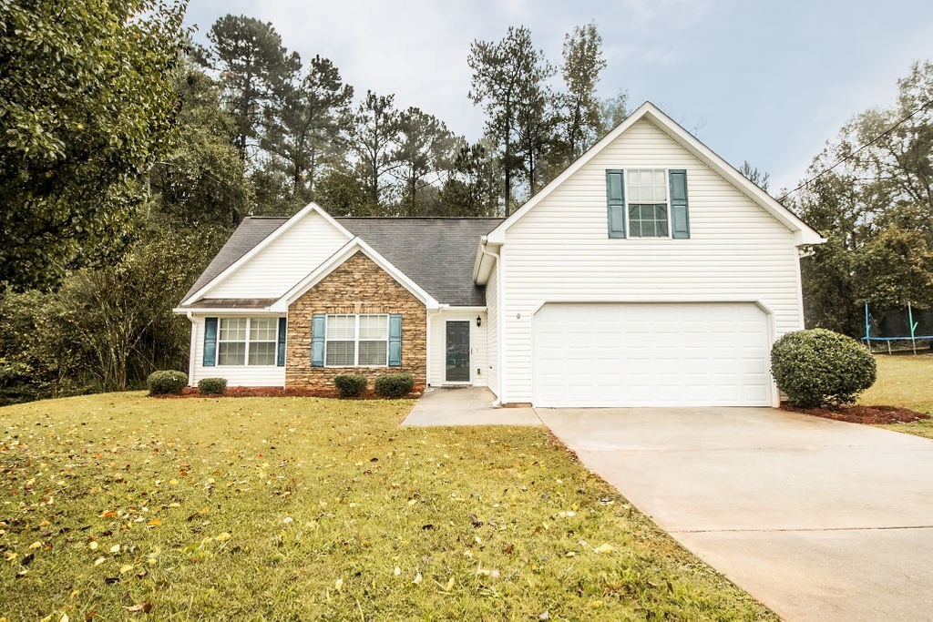 352 Autumn Ridge Trail Gray, GA 31032 - Photo 2 of 36 a view of a house with a yard and potted plants