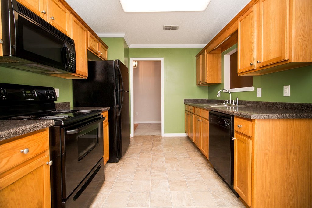 352 Autumn Ridge Trail Gray, GA 31032 - Photo 11 of 36 a kitchen with stainless steel appliances granite countertop a refrigerator a stove top oven a sink and dishwasher