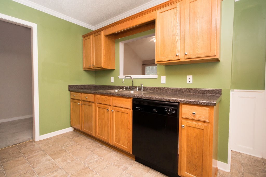 352 Autumn Ridge Trail Gray, GA 31032 - Photo 12 of 36 a kitchen with granite countertop a sink stainless steel appliances and cabinets