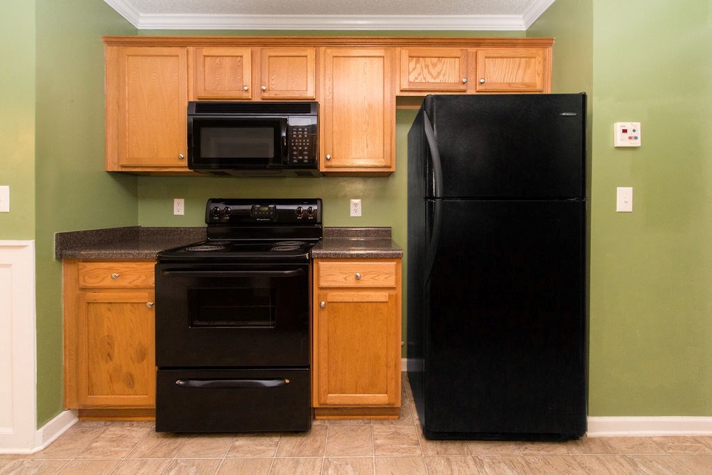 352 Autumn Ridge Trail Gray, GA 31032 - Photo 13 of 36 a kitchen with a refrigerator and a stove