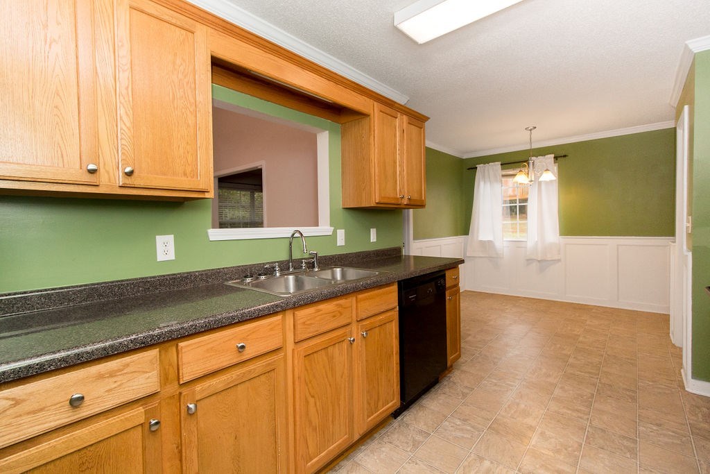 352 Autumn Ridge Trail Gray, GA 31032 - Photo 14 of 36 a kitchen with granite countertop a sink and a wooden cabinets