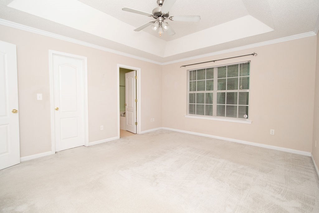 352 Autumn Ridge Trail Gray, GA 31032 - Photo 19 of 36 an empty room with windows and ceiling fan