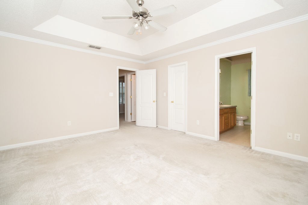 352 Autumn Ridge Trail Gray, GA 31032 - Photo 20 of 36 an empty room with a ceiling fan and a window