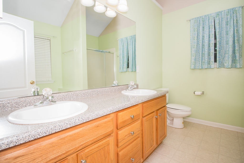 352 Autumn Ridge Trail Gray, GA 31032 - Photo 21 of 36 a bathroom with a granite countertop sink and a mirror