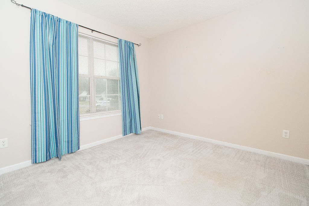 352 Autumn Ridge Trail Gray, GA 31032 - Photo 23 of 36 a view of an empty room with a window