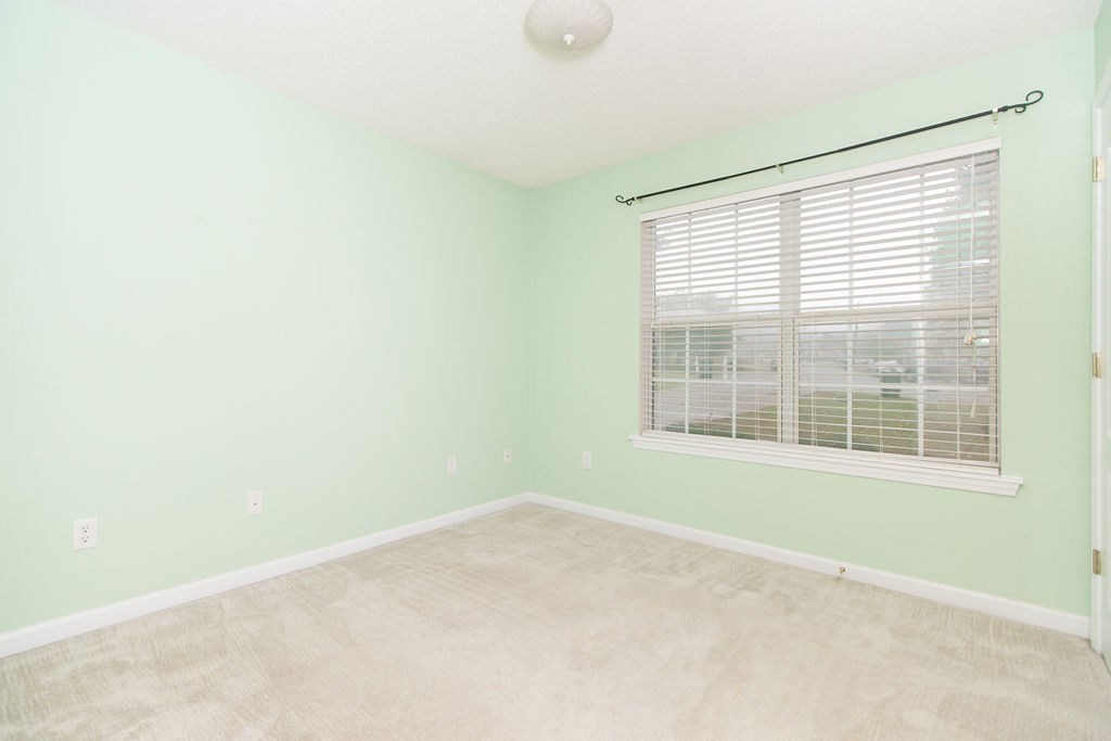 352 Autumn Ridge Trail Gray, GA 31032 - Photo 27 of 36 a view of an empty room with a window