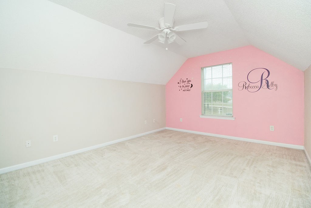 352 Autumn Ridge Trail Gray, GA 31032 - Photo 31 of 36 an empty room with windows and fan
