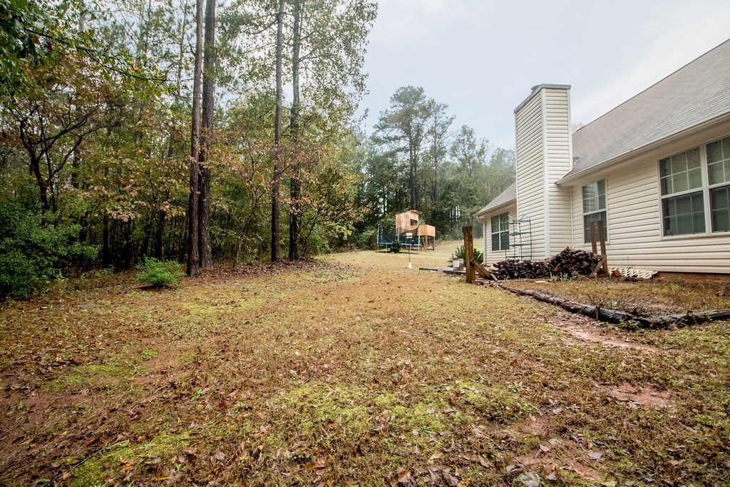 352 Autumn Ridge Trail Gray, GA 31032 - Photo 35 of 36 a backyard of a house with lots of green space