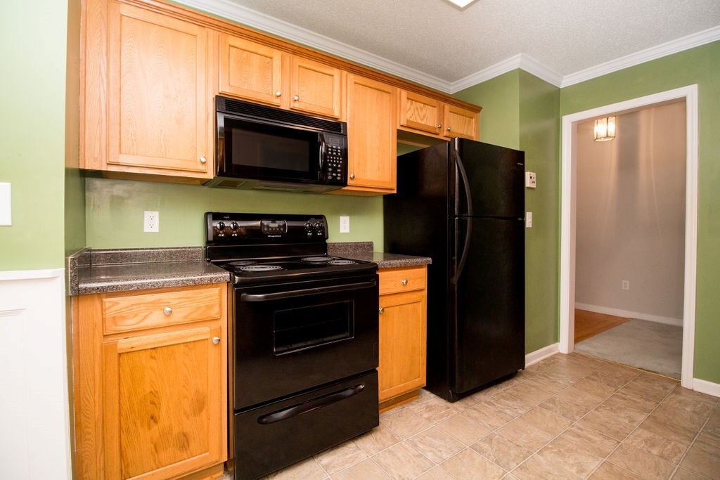 352 Autumn Ridge Trail Gray, GA 31032 - Photo 10 of 36 a kitchen with stainless steel appliances granite countertop a refrigerator stove and microwave