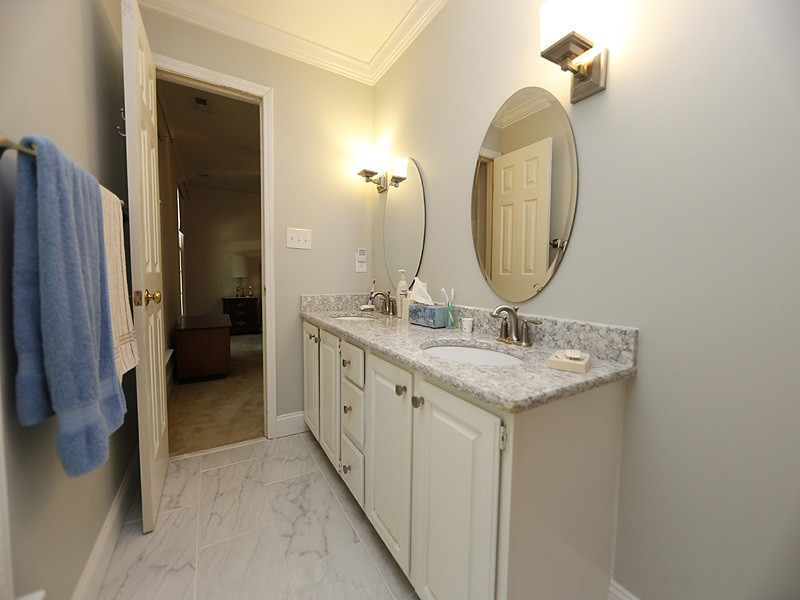 4812 Oak Way Raleigh, NC 27613 - Photo 9 of 18 Solid surface countertops and very nice flooring make this master bath a winner. Master bath