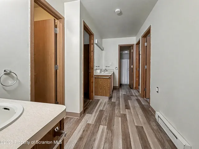 a view of a bathroom with a sink and mirror