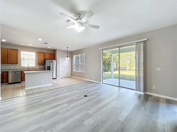 a bathroom with a granite countertop shower a toilet and a sink