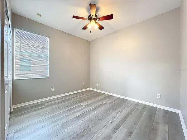 a view of an entryway with wooden floor