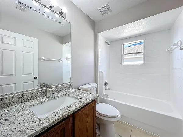 a view of a room with shelf on the wall