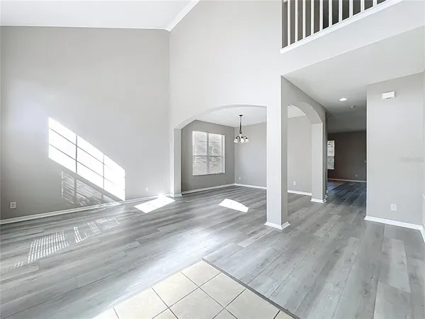 a view of a hallway with a chandelier