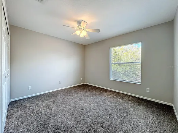 a view of hallway with closet