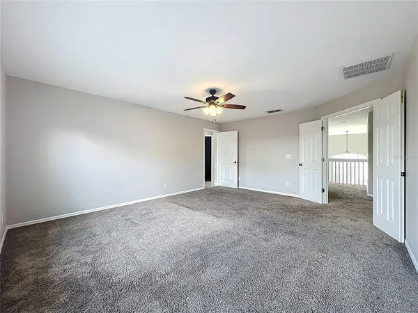a bathroom with a granite countertop sink mirror and shower