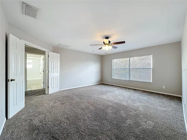 a bathroom with a granite countertop sink mirror and shower