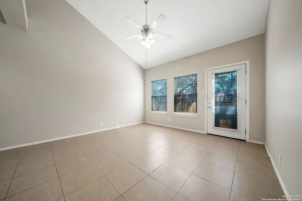 a view of an empty room with a window