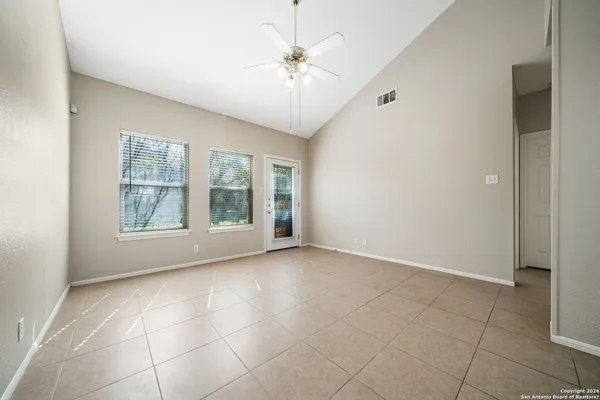 a view of an empty room with a window