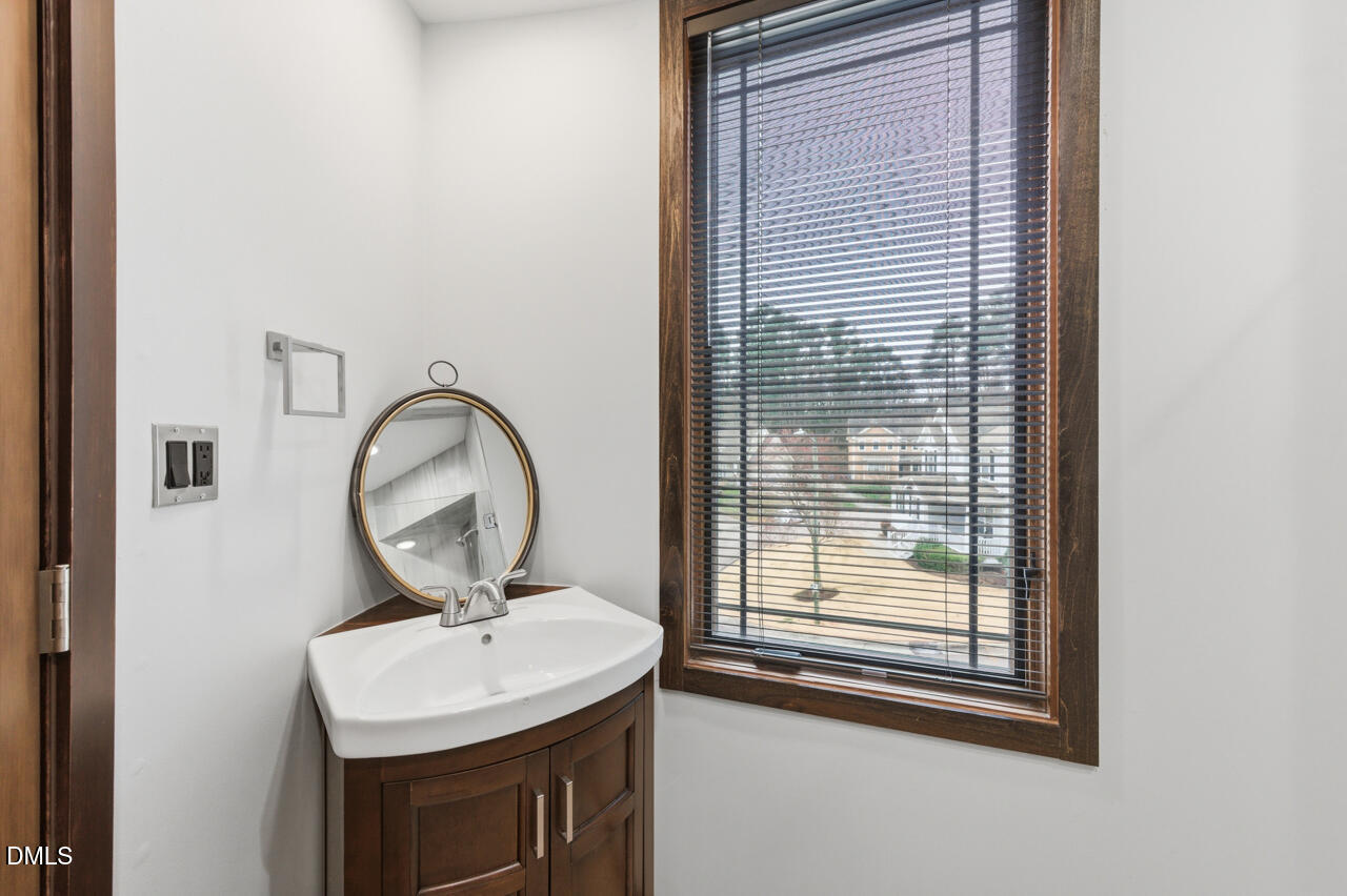 3315 Denada Path Durham, NC 27707 - Photo 50 of 74 a bathroom with a sink and a mirror