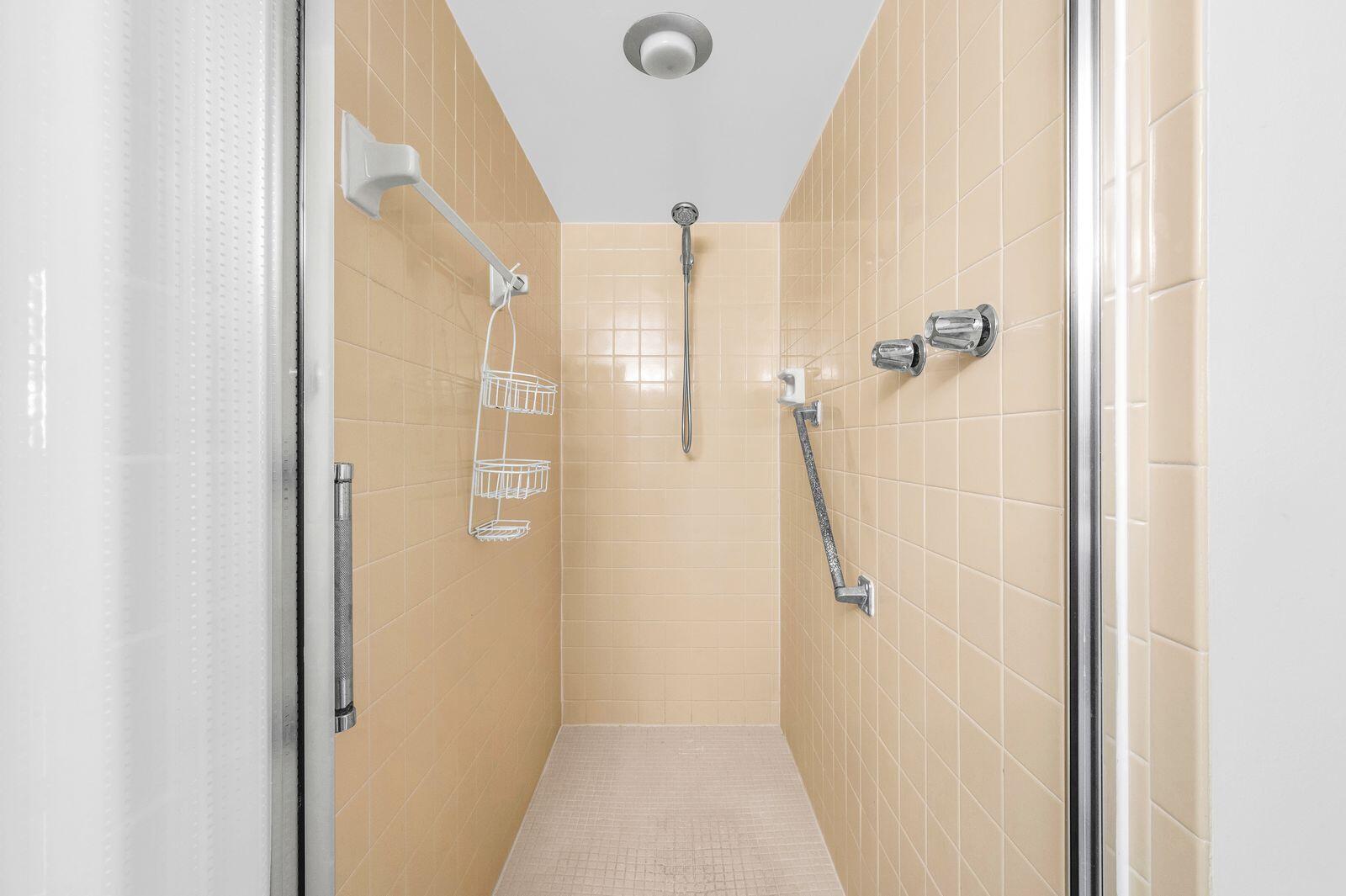 6461 Northwest 2nd Avenue, Unit 403 Boca Raton, FL 33487 - Photo 11 of 22 a bathroom with a shower