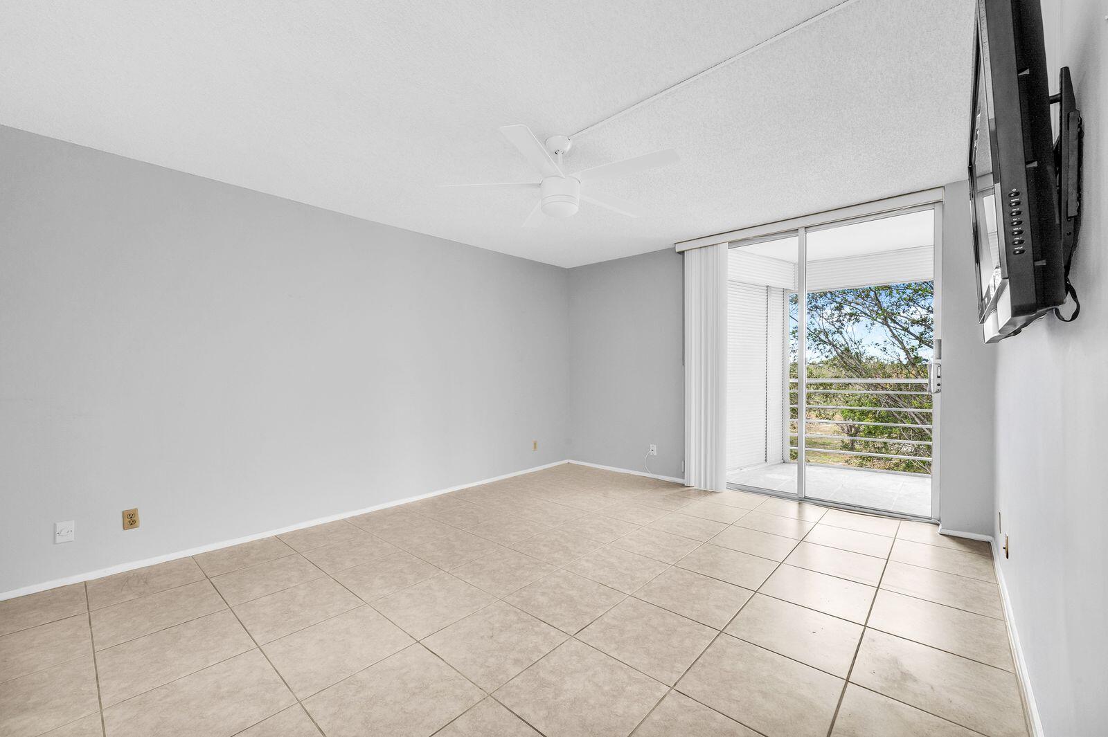 6461 Northwest 2nd Avenue, Unit 403 Boca Raton, FL 33487 - Photo 16 of 22 a view of an empty room with a window