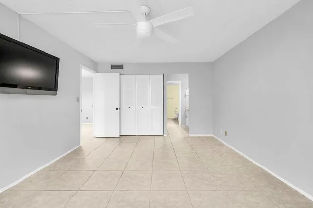 a view of an empty room with a flat screen tv