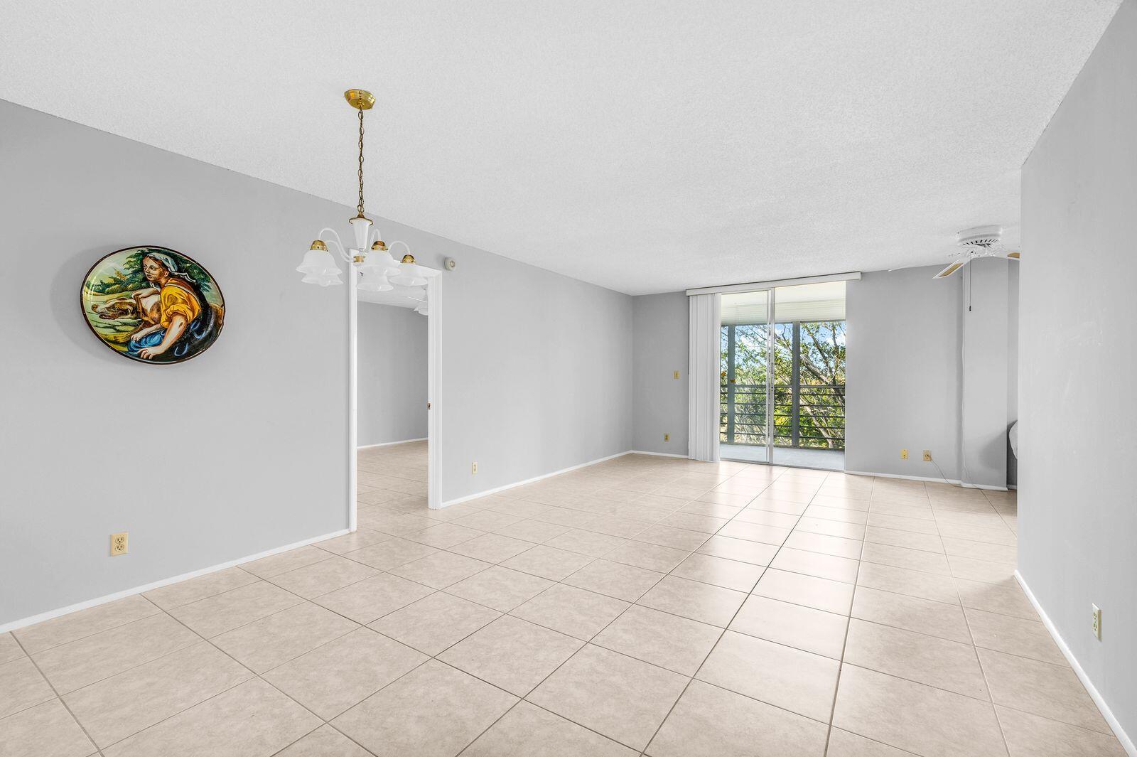 6461 Northwest 2nd Avenue, Unit 403 Boca Raton, FL 33487 - Photo 6 of 22 a view of an empty room with a window